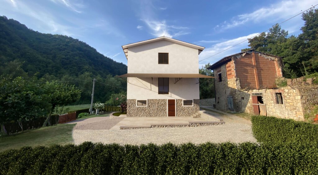 Vista frontale del rustico riqualificato tramite fotoinserimento architettonico realistico